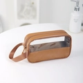 Brown faux leather makeup bag with transparent window and zipper on a white table - Brown Small