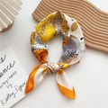 Silk-like square scarf featuring bright yellow and orange floral patterns in a knot style - 70cm / Leaf Center Orange Edge