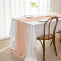 Close-up of elegant peach chiffon table runner with soft drapes and sheer texture - Champagne Pink