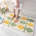 Plush bathroom mat with yellow and green leaf patterns on a beige background - 40*60cm / Lemon Tree