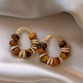 Close-up of golden tiger eye earrings on silk, showing geometric bead and ring details - 15# Ear Buckle - Gold - Brown - Round