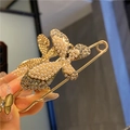 Close-up of golden butterfly brooch pin with inlaid pearls and crystals held in hand - Golden Pearl Rhinestone Butterfly Brooch (7.5cm)