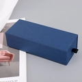 Single blue rectangular drawer gift box with black ribbon pull on grey background - Blue