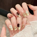 Handmade amber leopard press-on nails with 3D camellia flowers and rhinestone accents - XS / Medium Oval Style