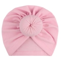 Detail view of pink cotton baby turban hat with soft donut knot decoration on white background - One Size / Pink