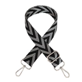 Close-up of black and white herringbone canvas bag strap with silver metal hardware - Black Silver Buckle