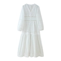 Detailed view of white lace hollow V-neck bodice with button details on long sleeve dress - S / White