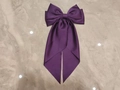 Elegant purple satin oversized bow hair clip with flowing ribbon on marble background - Purple