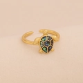 Detailed close-up of golden turtle ring featuring iridescent shell inlay on beige fabric - Black Grey Abalone Shell Sea Turtle Open Ring (8#Black Grey)