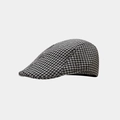 Macro-detail van de houndstooth-stoftextuur op deze stijlvolle herfst- en winterpet - Grijs