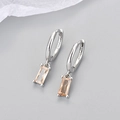 Detailed macro view of S925 sterling silver earring with champagne rectangle zircon stone - Copper / White Gold with Champagne Zircon