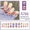 Set unghie finte viola pastello con illustrazioni di tulipani e arcobaleni colorati - Stile Faccina Sorridente Tulipano Viola Taro (A766)