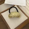 Golden punk style metal ponytail cuff with textured irregular pattern and black elastic band - 18# Gold Irregular Arc