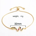 Detail of adjustable brass gold-plated snake charm bracelet with colorful cubic zirconia - Snake Style 1