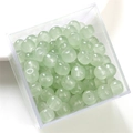 Pale green semi-transparent glass barrel beads in a clear box for DIY jewelry making - Green Apple Bead