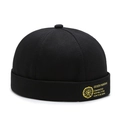 Classic black brimless docker hat with gold embroidery on a cotton twill textured cap - Black (Woven Label)