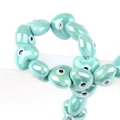 Handmade turquoise heart-shaped ceramic evil eye beads for DIY jewelry making - 13x14mm / Malachite green