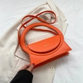Schicke orangefarbene strukturierte Handtasche aus Kunstleder mit rundem Griff - Orange