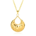 Macro shot of 18k gold plated hammered round pendant with teardrop cutout on white background - Pendant Necklace / Gold