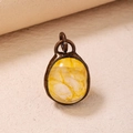 Vintage style yellow crystal pendant with antique bronze frame and natural ice textures - Citrine