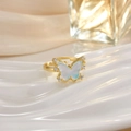 Macro shot of gold butterfly ring featuring white shells and crystal zircons - White Shell Texture Butterfly Style (JZ0145)