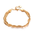 Vista detallada de una pulsera trenzada de varios hilos en acero inoxidable dorado con cierre - Dorado