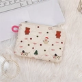 Close-up of beige quilted Christmas pouch with cartoon bear and snowman patterns - Snowman Bear