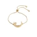 Macro detail of adjustable gold star and moon bracelet featuring shimmering zircon stones - Moon Star with Box Chain