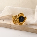 Detailed view of snake texture 18k gold steel ring featuring a dark blue gemstone - Gold Blue Goldstone
