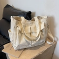 Beige corduroy tote bag with large pockets and adjustable strap for daily commute - Off-white
