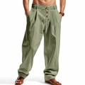 Detail of olive green linen trousers featuring a drawstring waist and button fly design - Army Green