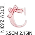 Detailed size view of pink embroidered letter C patch with a decorative bow motif - Pink Letter C