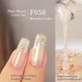 F058 shimmer nail gel with gold foil and iridescent glitter in translucent pink - F058 Brocade Flow