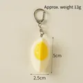 Realistic PVC boiled egg keychain pendant with metal clip, white and yellow, 5cm height - 1/4 Hard-boiled Egg - Lobster Clasp