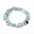 Handmade bracelet featuring irregular light blue natural crystal stones and dark blue accents - Aquamarine
