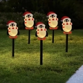 Solar Christmas penguin lawn lights set of 5 with glowing bellies and Santa hats - Penguin (Black Tube)