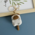 Handmade crochet cat keychain in beige and brown yarn with golden metal ring accessory - Coffee Face Cat