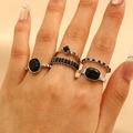 Vintage silver ring set with black rhinestones and geometric crystal accents on hand - Black Gemstone Silver Stackable Ring Set (1029)