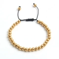 Details des verstellbaren schwarzen Webarmbands mit goldenen Edelstahlperlen - Gold 6mm