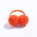 Detailed view of elastic hair tie featuring two vibrant orange plush pom-pom balls - Bright Orange (9)