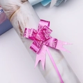 Macro detail of pink purple ribbon bow with rose patterns for gift packaging decoration - Rose Red Rose