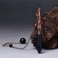 Detail of a black hexagonal prism stone pendant with antique bronze filigree cap and chain - Antique Bronze Black Agate