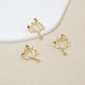 Golden cloud necklace pendant with lightning motif and sparkling teardrop stone charms - White