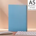 A5 light blue soft leather notebook on a modern desk with white office accessories - Blue Soft Leather