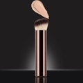 Angled foundation brush with gradient bristles and brown handle on dark background - Long Base Concealer Brush