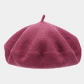 Detailed close-up of the thick wool felt texture and stem on the purple beret hat - One Size / Dusty Pink