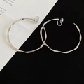 Detail of silver twisted hoop earrings with irregular wave texture and clip-on backings - Clip-on Style / 6cm / Silver