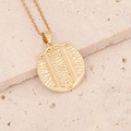 Detailed view of an 18K gold zodiac pendant with intricate dragon scale texture detail - 5#Gemini
