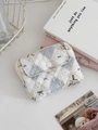 Detailed close-up of quilted floral coin purse with lace trim and secure snap closure - Quilted Teddy Bear