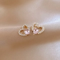 Detail of pink heart crystal stud earrings with gold plating on champagne silk background - 68# Micro-pave Double Heart Studs